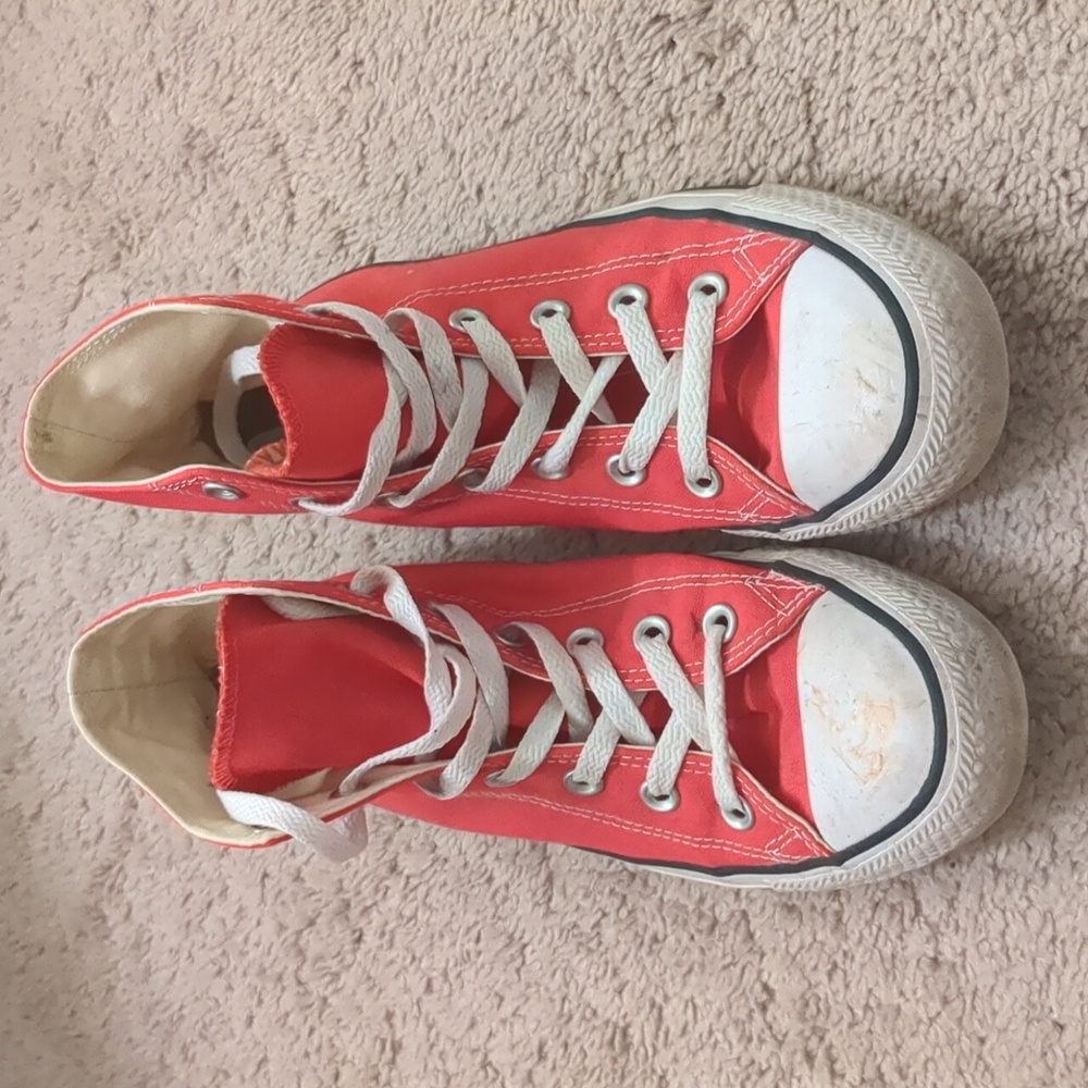 Red high top Chuck Taylor Converse